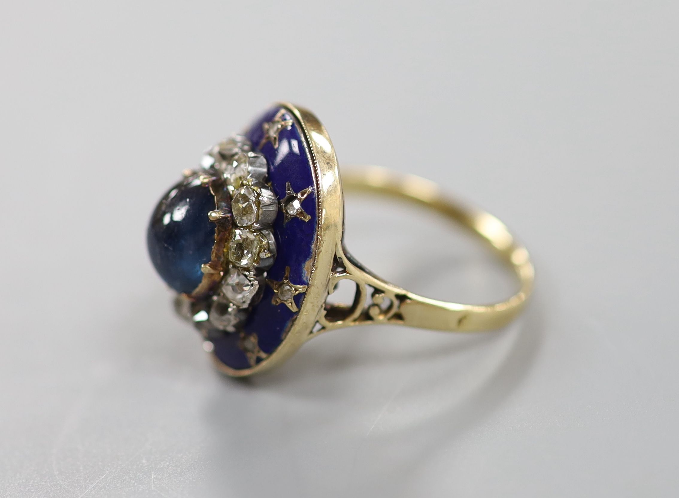 A 19th century French yellow metal (18ct poincon mark), cabochon sapphire, rose and old cut diamond and blue enamel set oval dress ring